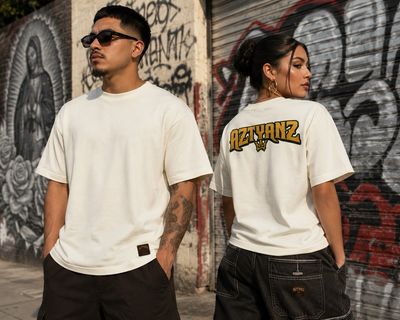 Models showing the front and back of the cream Aztyanz Vintage T-shirt